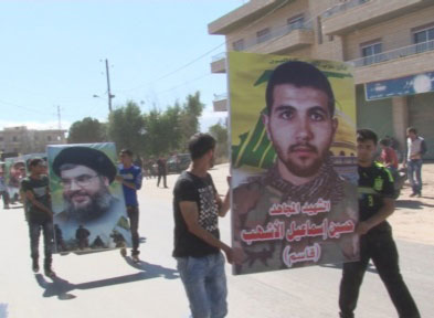 صورة الشهيد حسين إسماعيل الأشهب تتقدم موكب التشييع حزب الله يشيع ثلة من الشهداء في الجنوب والبقاع وبيروت