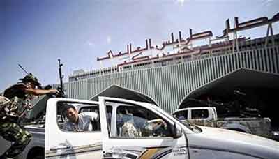 مطار طرابلس في ليبيا البرلمان الليبي: ’فجر ليبيا’ و’أنصار الشريعة’ مجموعتان إرهابيتان